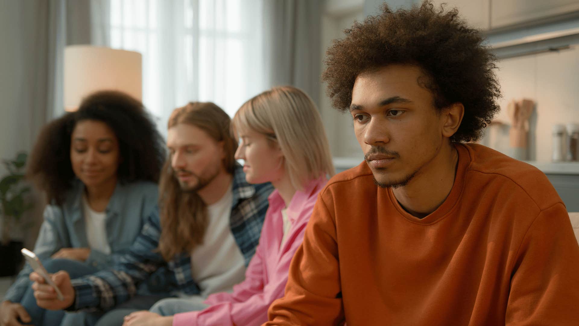 man feeling left out in group