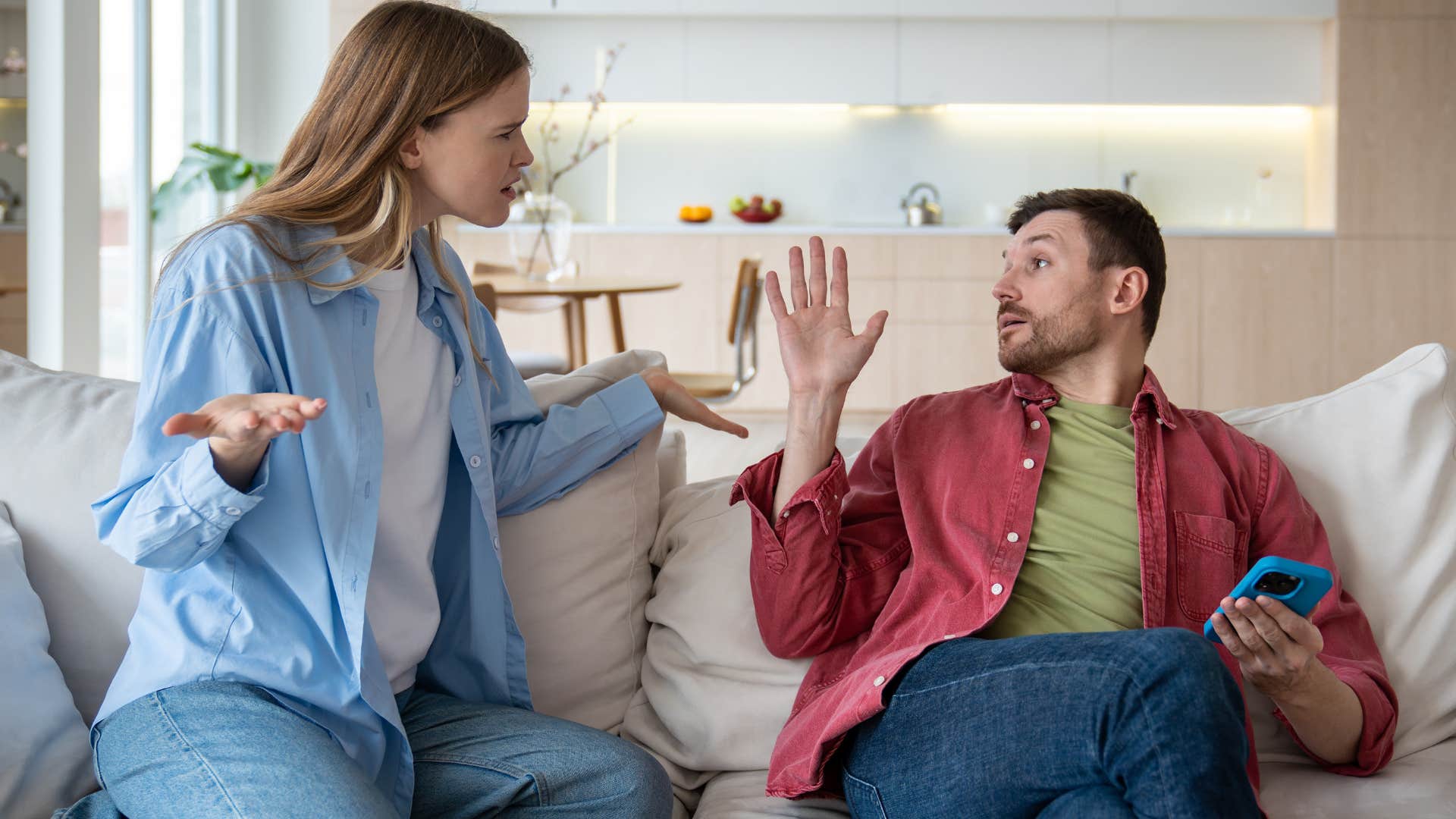 Woman arguing with her distracted partner