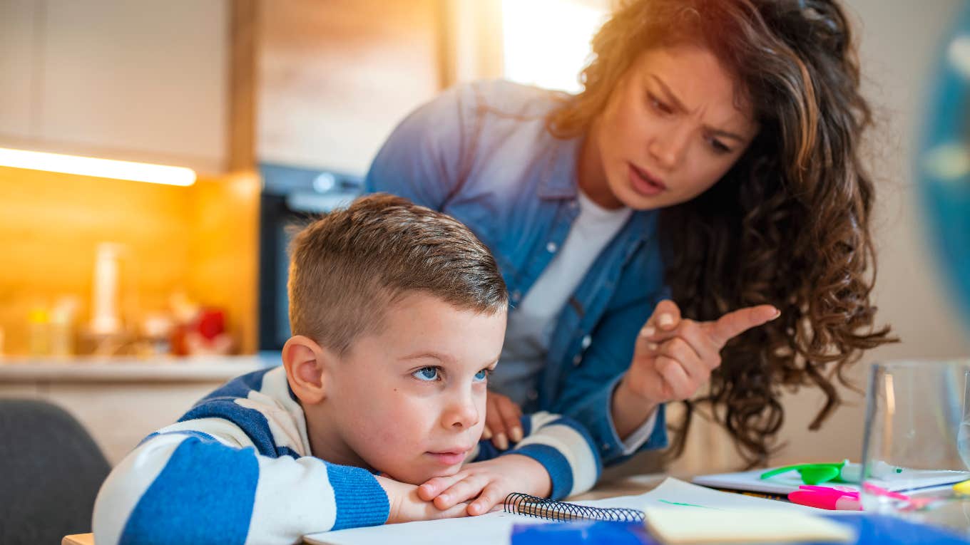 frustrated teacher trying to get student to focus