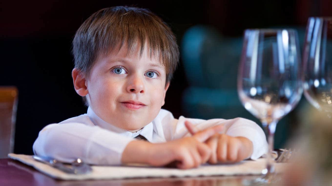 Kid at fine dining restaurant