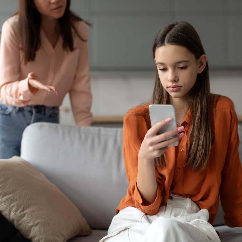 Teenage girl on her phone ignoring her mom