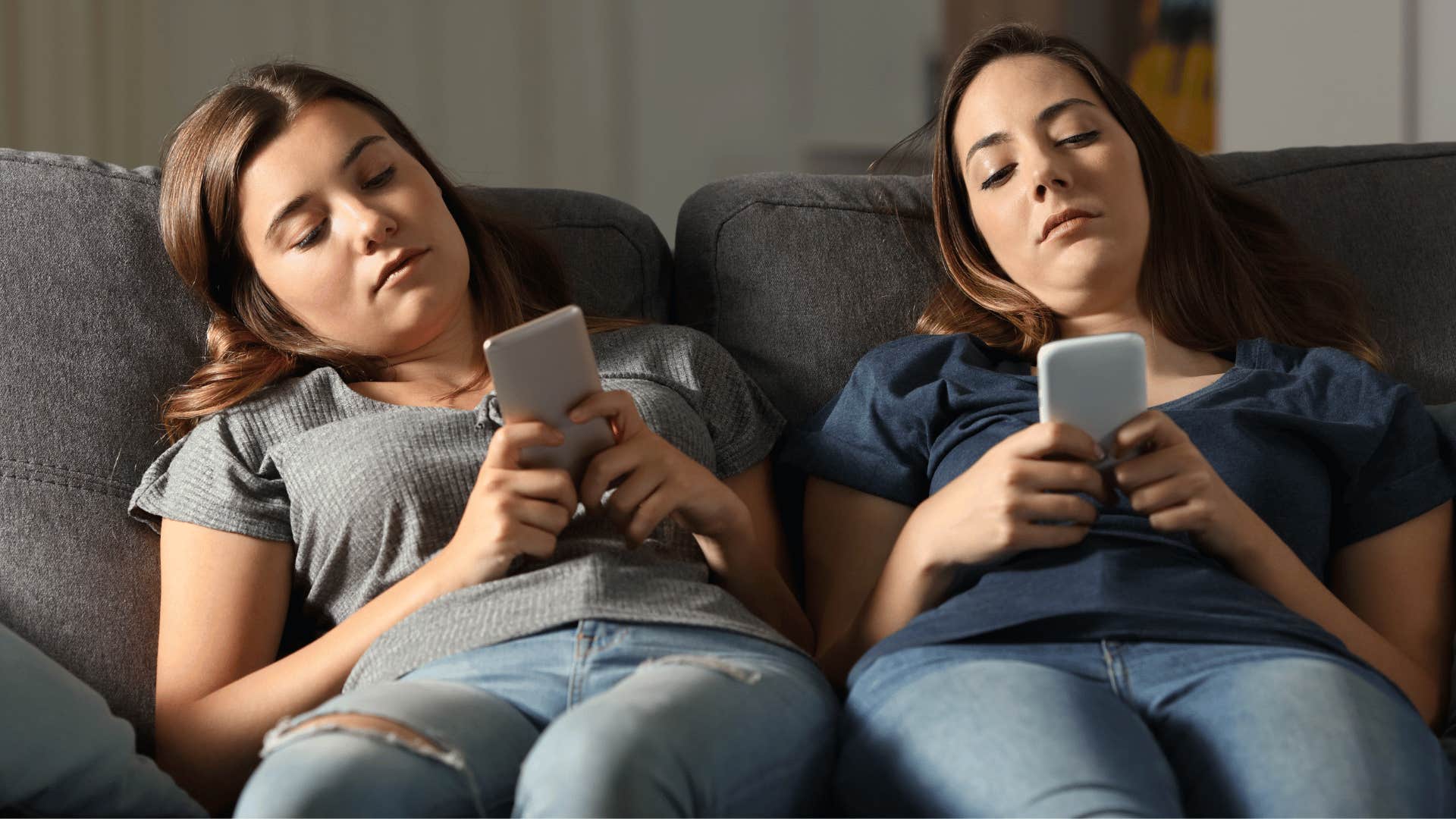 two women on their phones