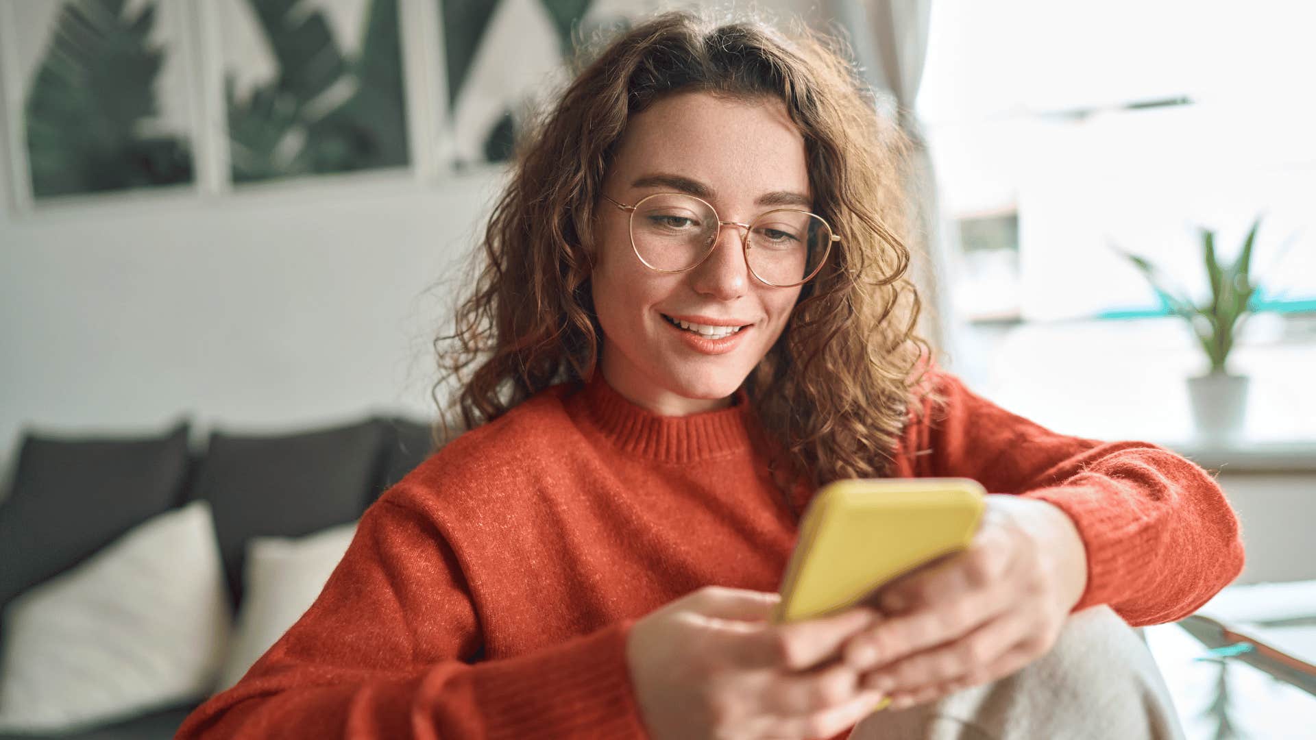 woman looking at phone