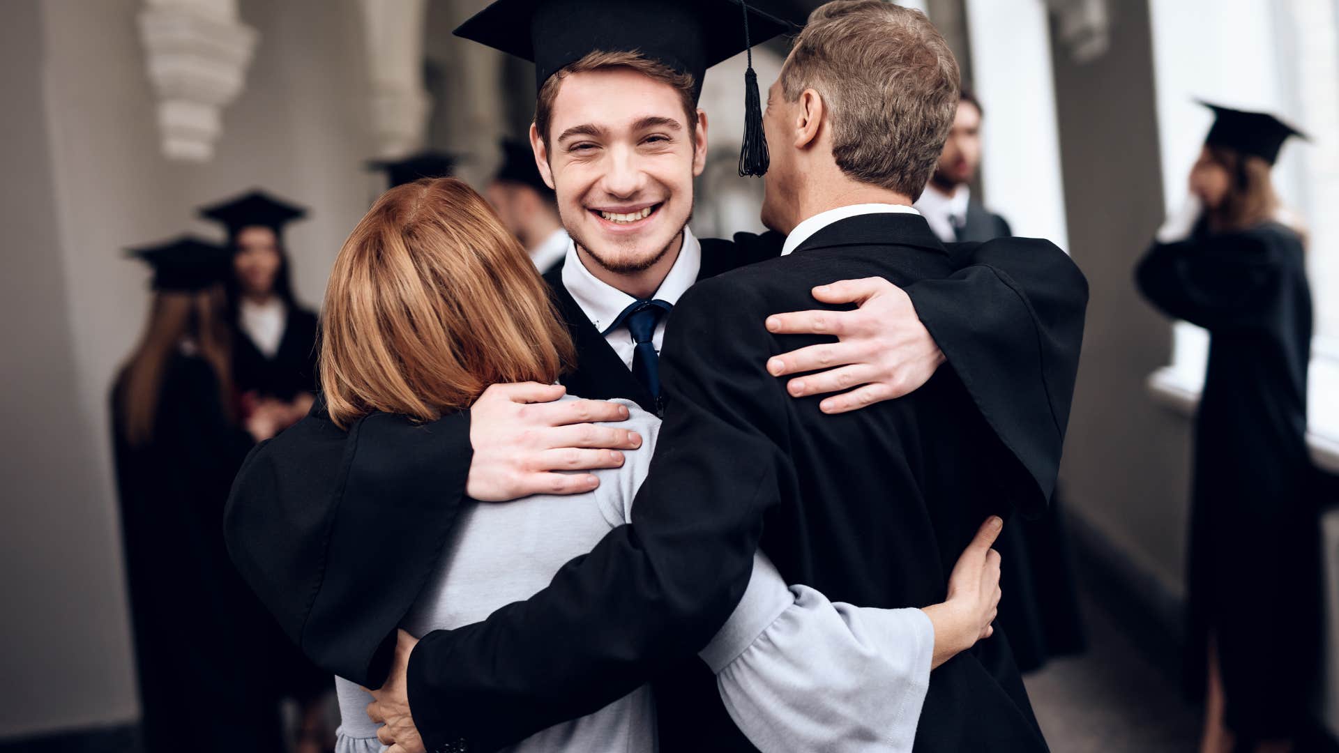 Son and parents happy at his graduation