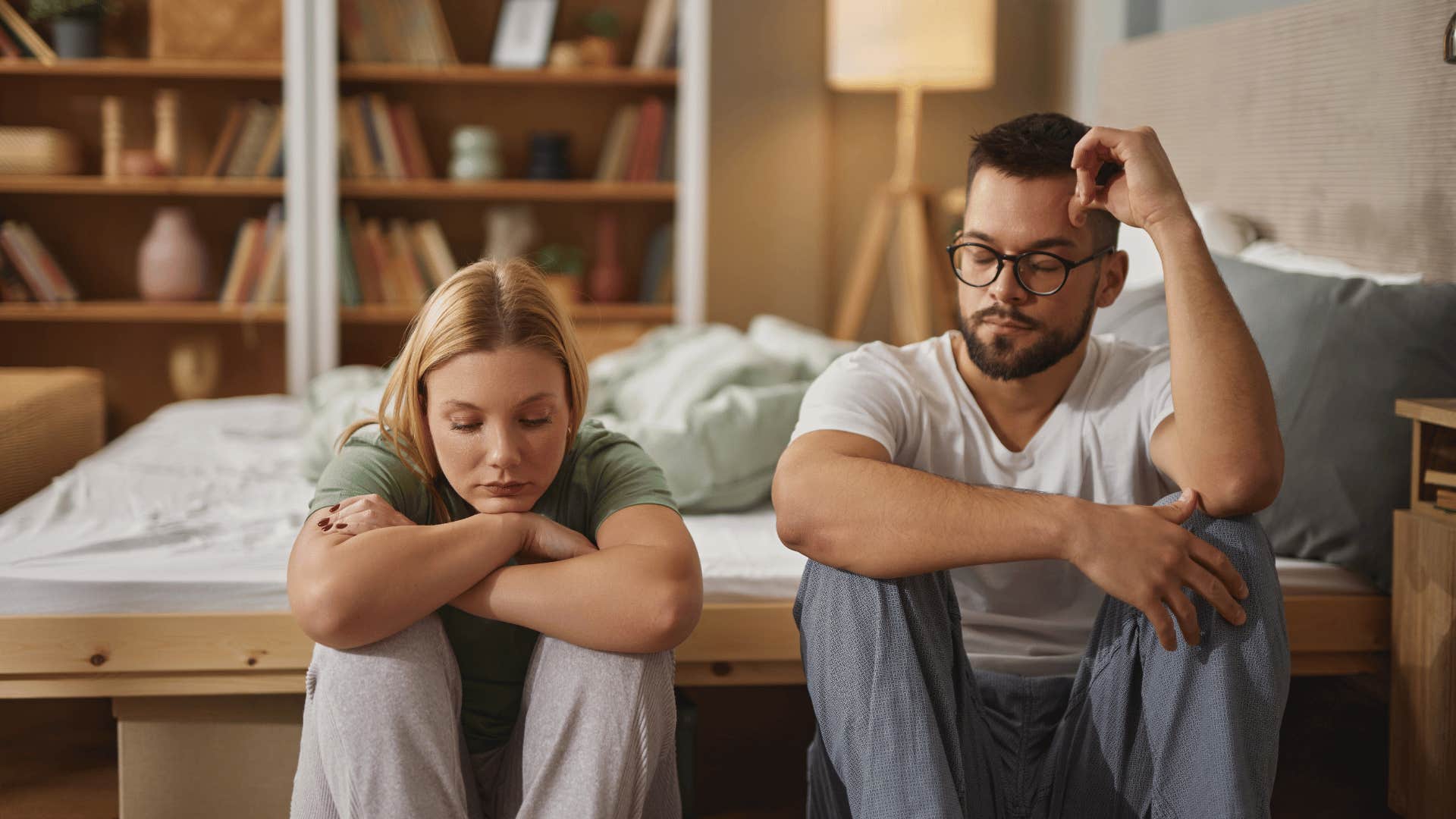 couple sitting next to each other not talking