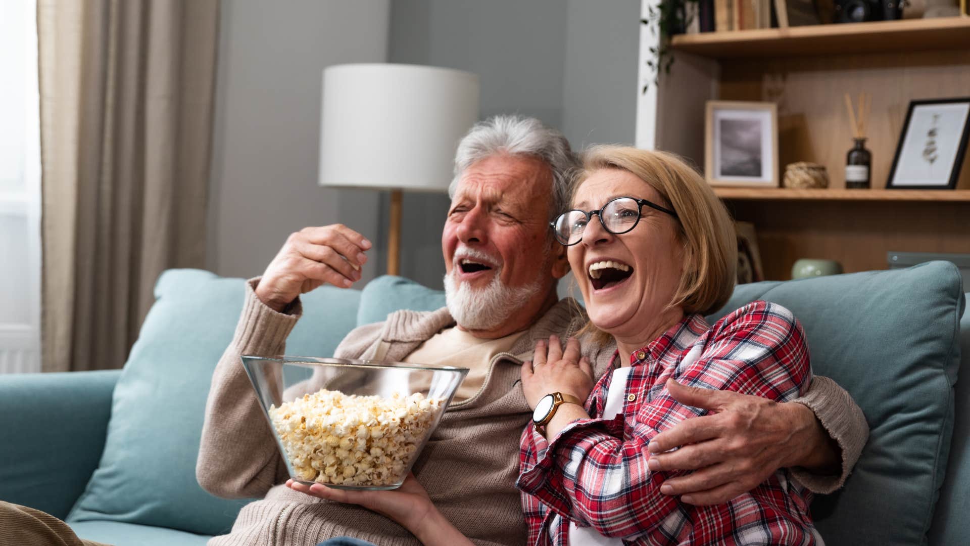 boomer couple watching cable TV