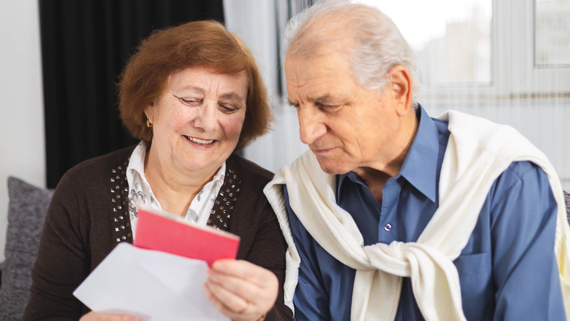 boomer couple reading store bought card