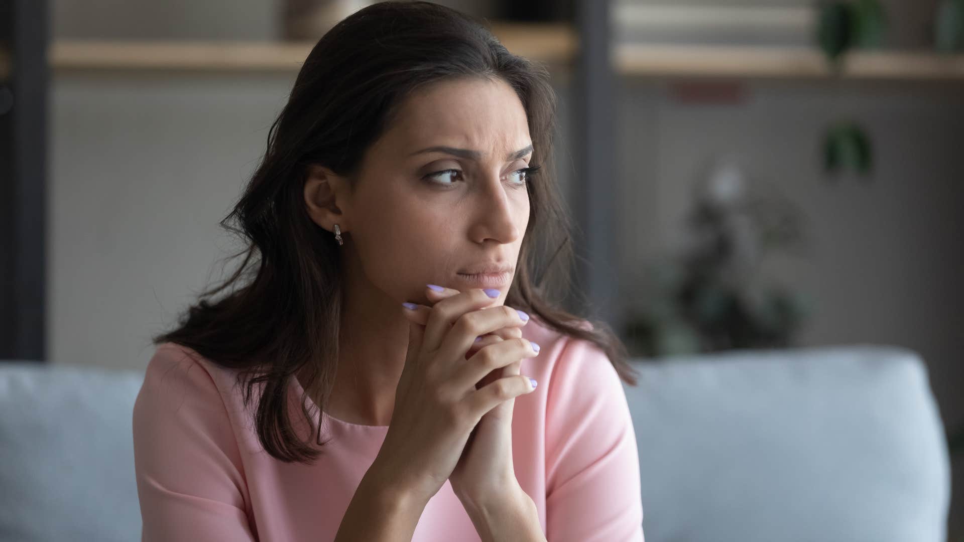 Anxious woman looking away from the camera.