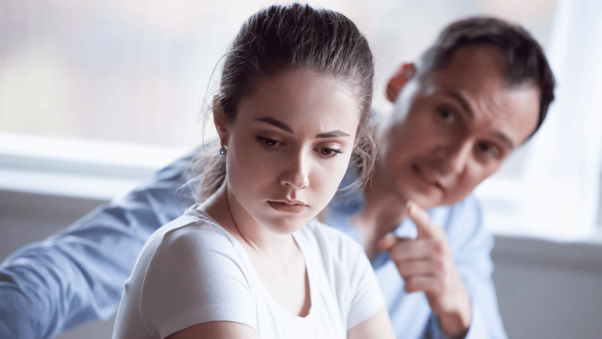 woman with her back turned to a man