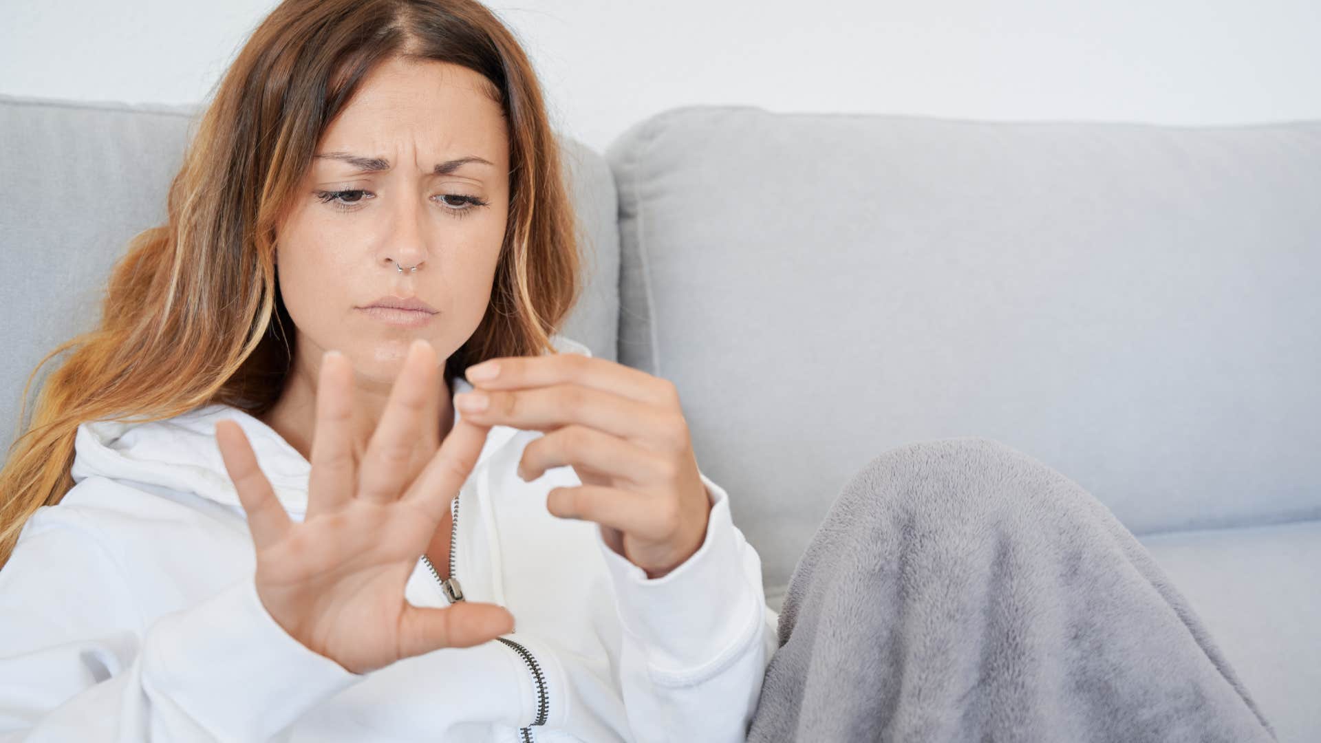 woman waiting for her nails to dry