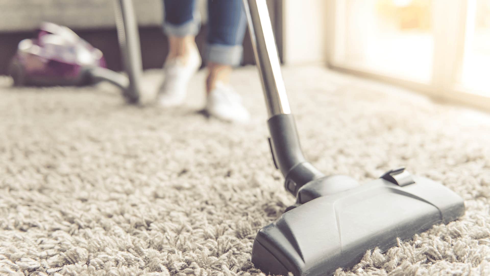 gen zer vacuuming carpet