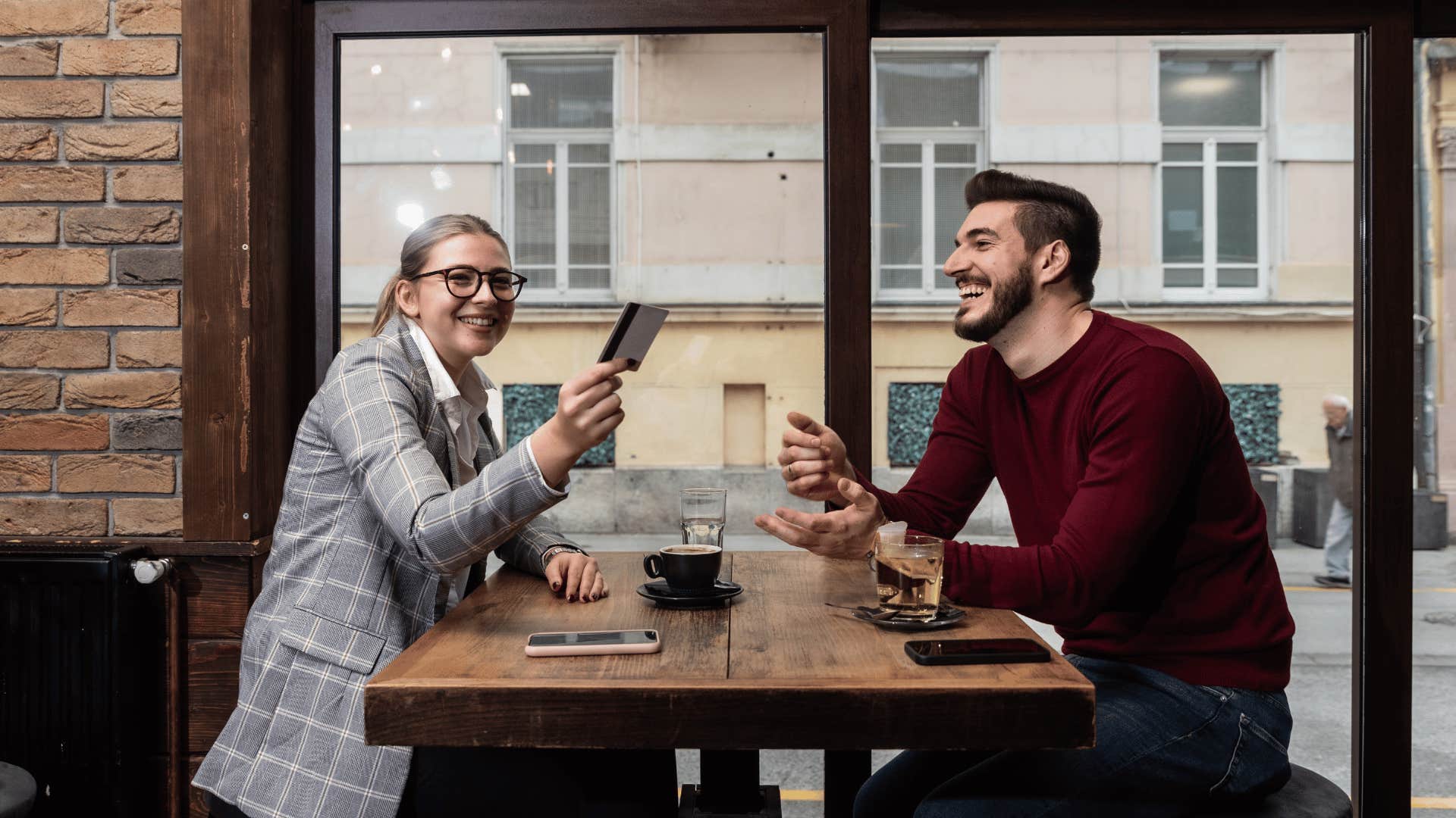 woman paying on a date