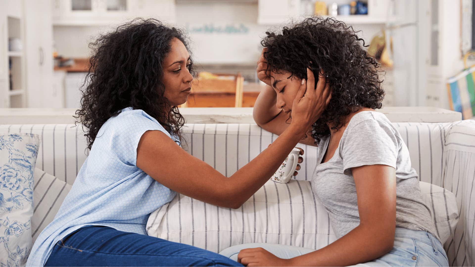 mom comforting daughter