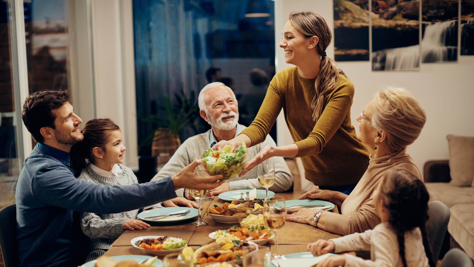 Happy multi-generation family enjoying in a lunch together at home.