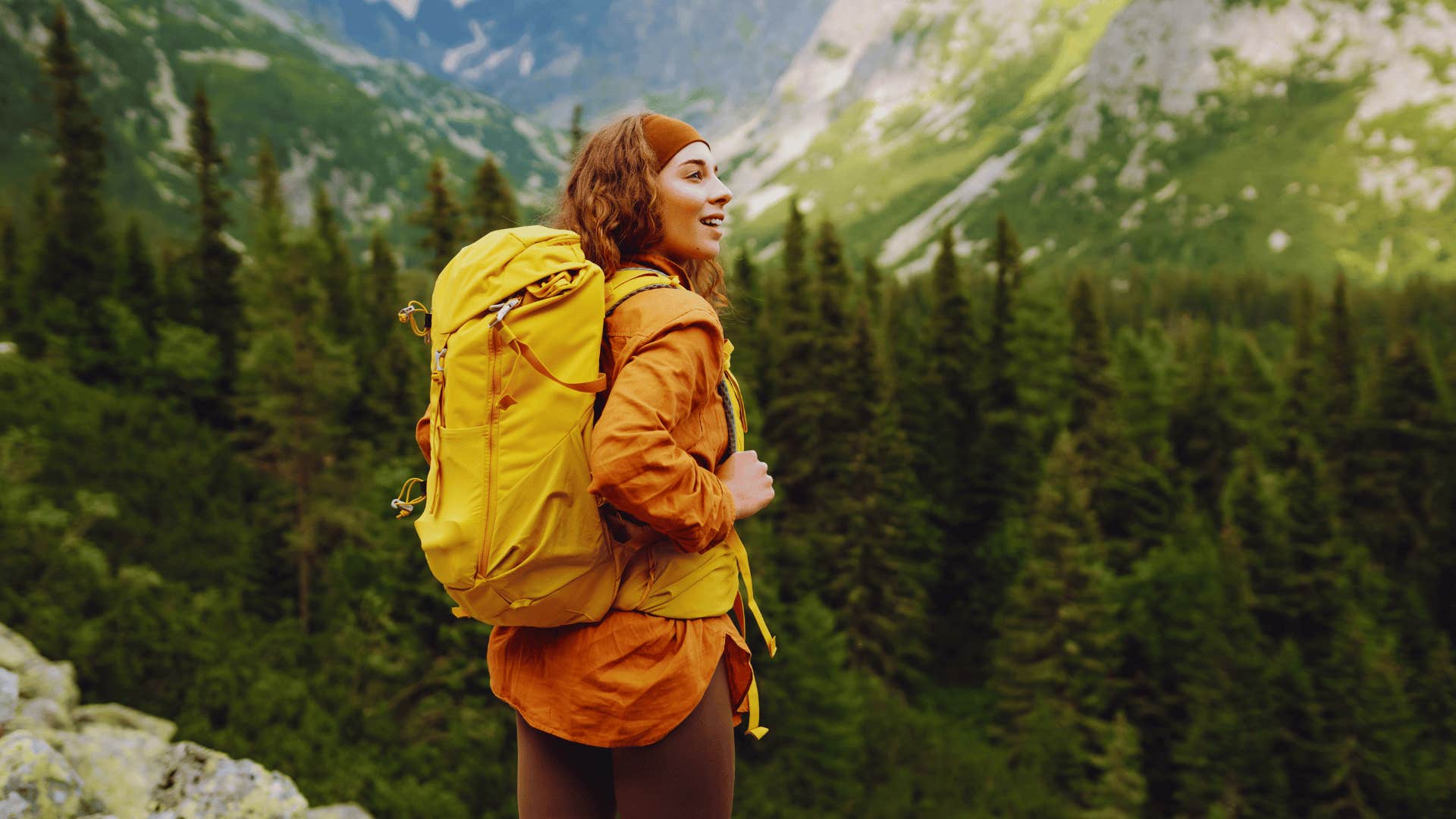 emotionally strong woman taking a risk backpacking