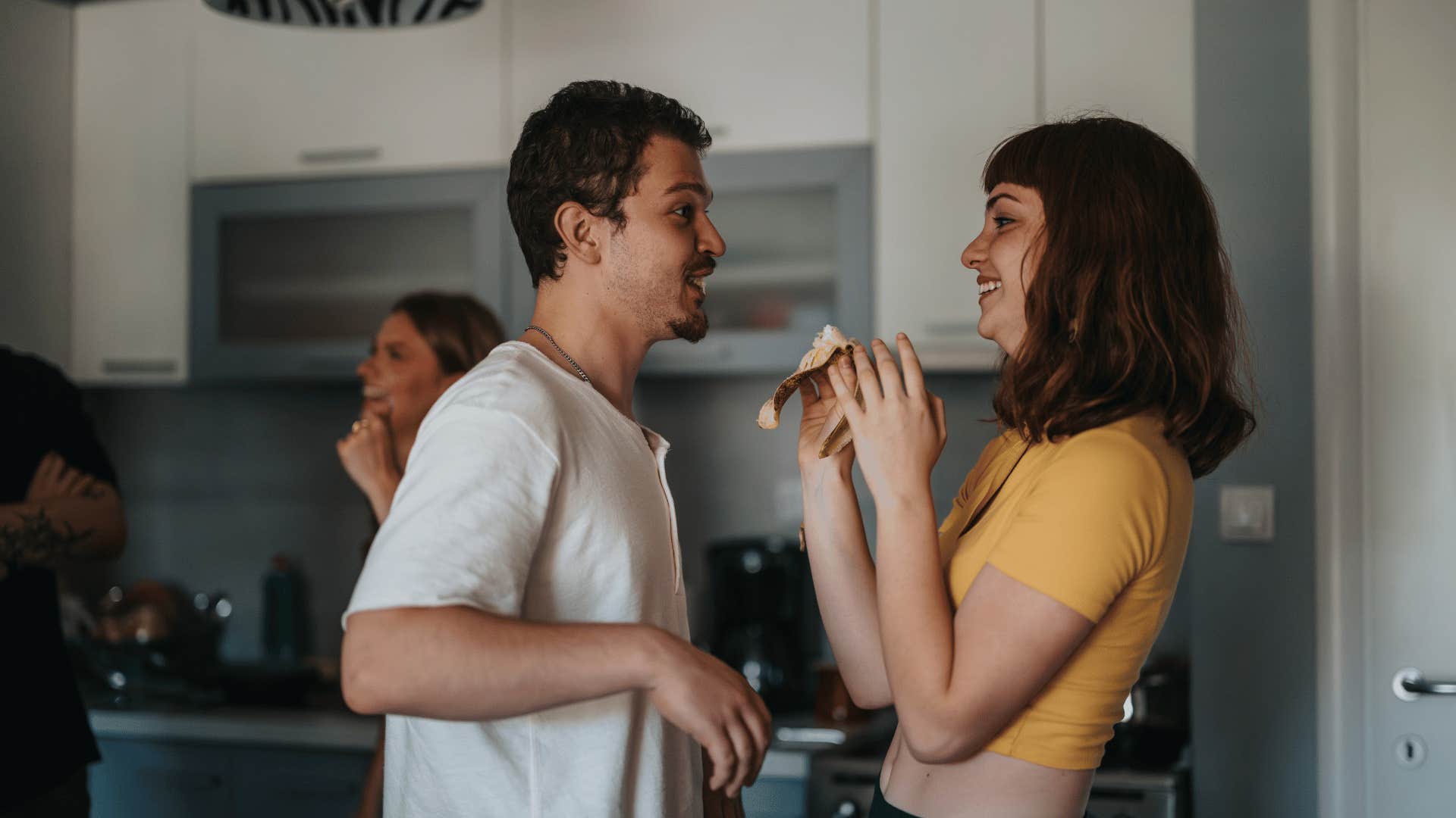 couple talking in kitchen