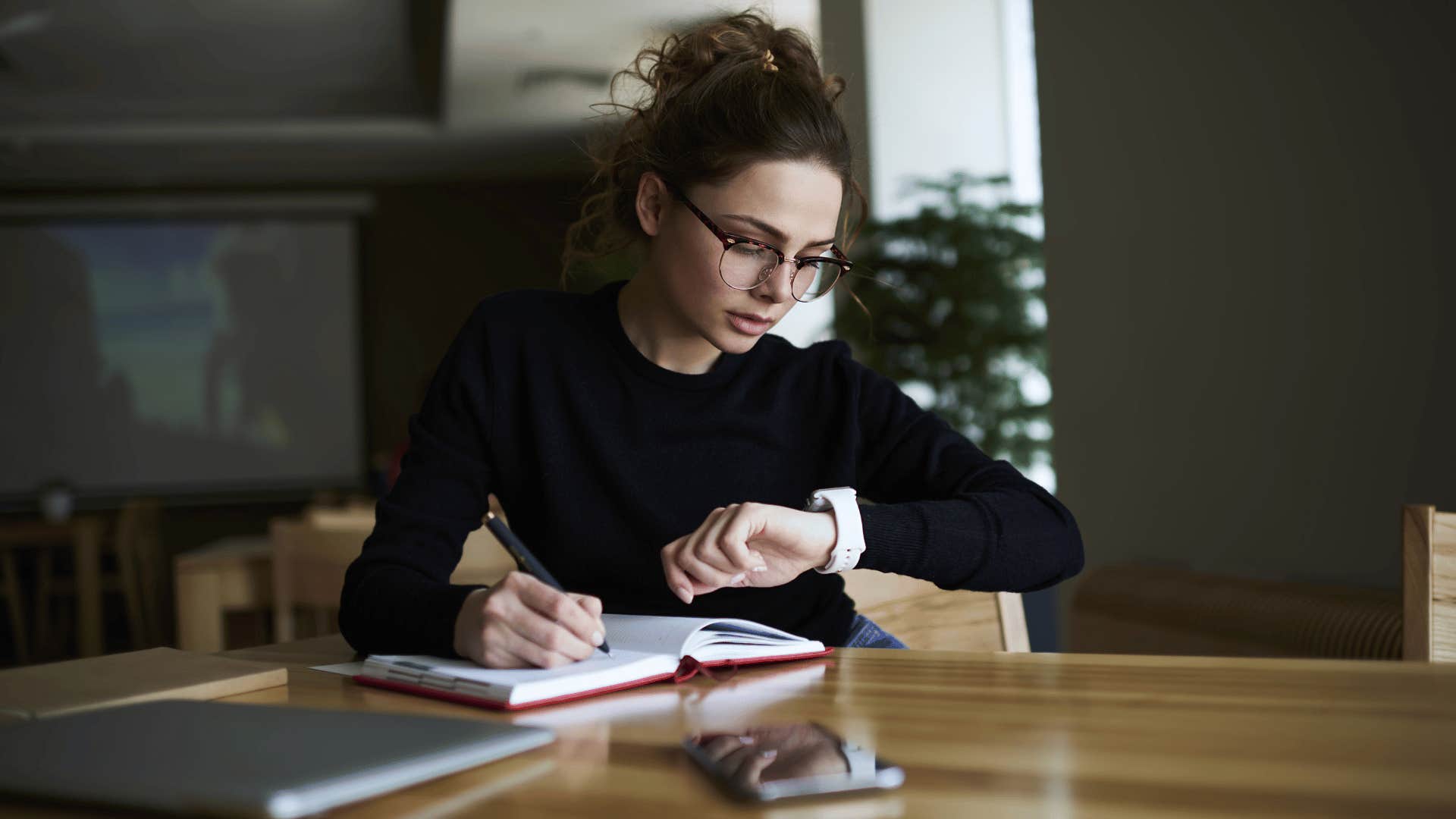 woman looking at watch