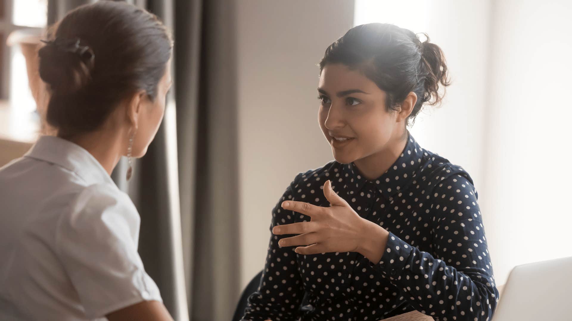 woman explaining something to coworker