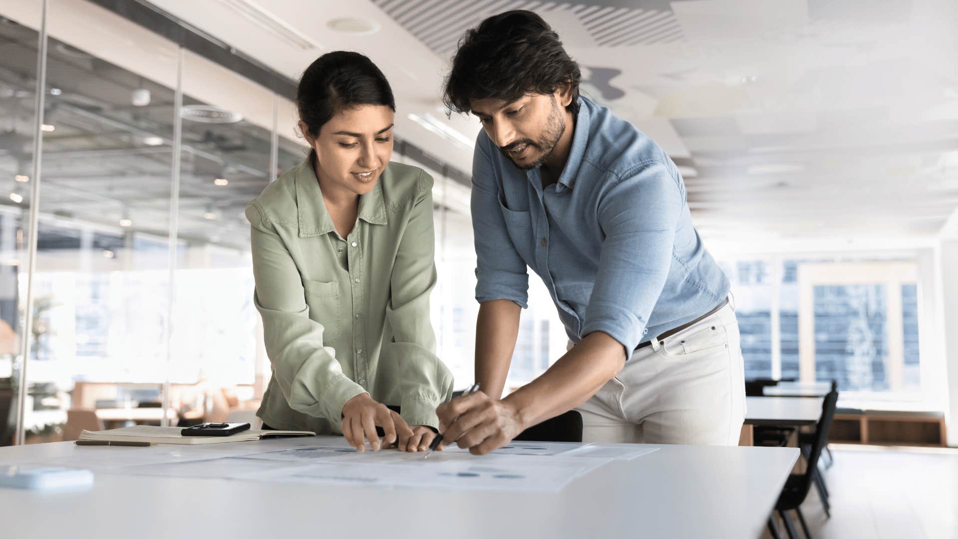 coworkers leaning in while speaking