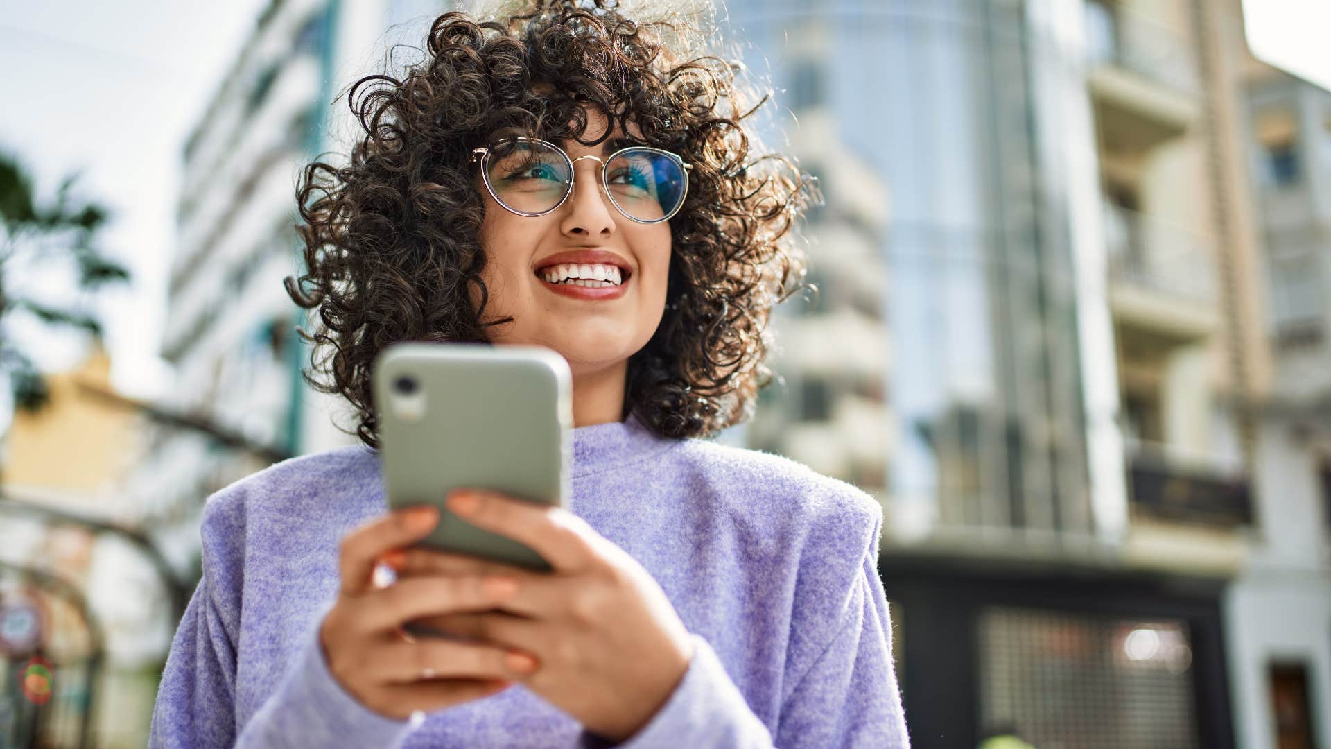 woman smiling about to call her parents