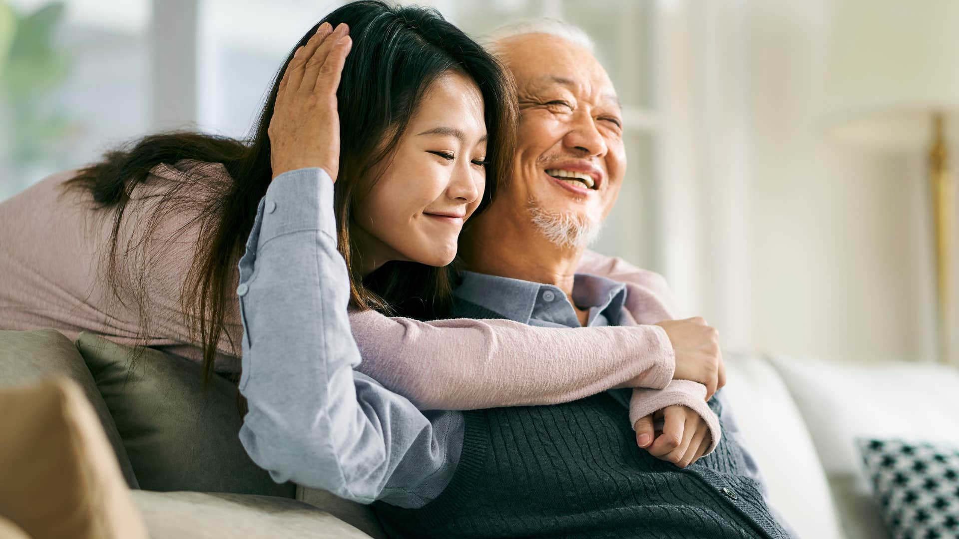 woman hugging her older dad