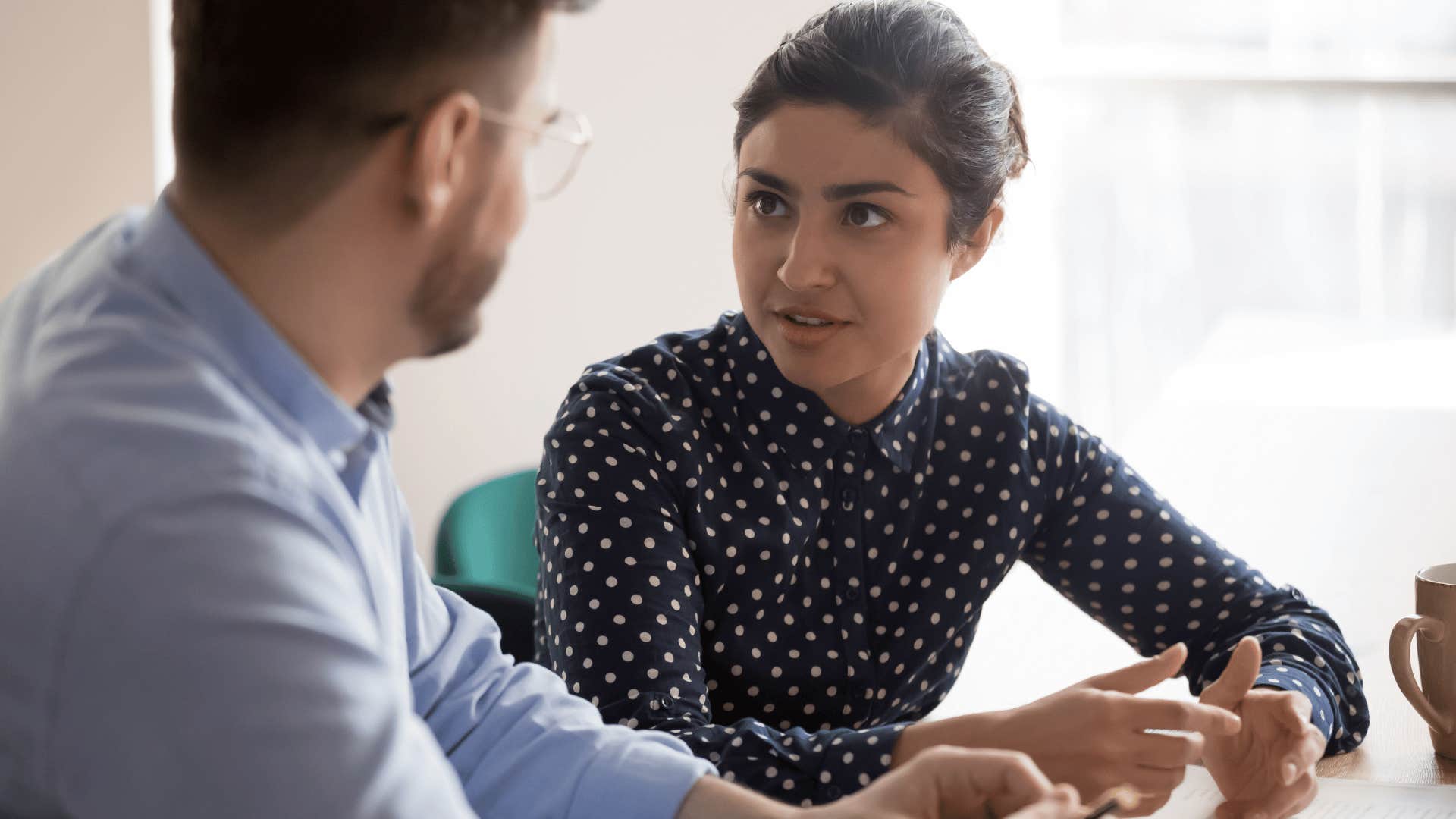 man and woman seriously talking to each other