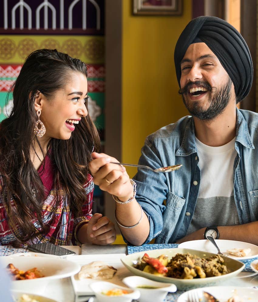 Joyous couple share and meal to live longer