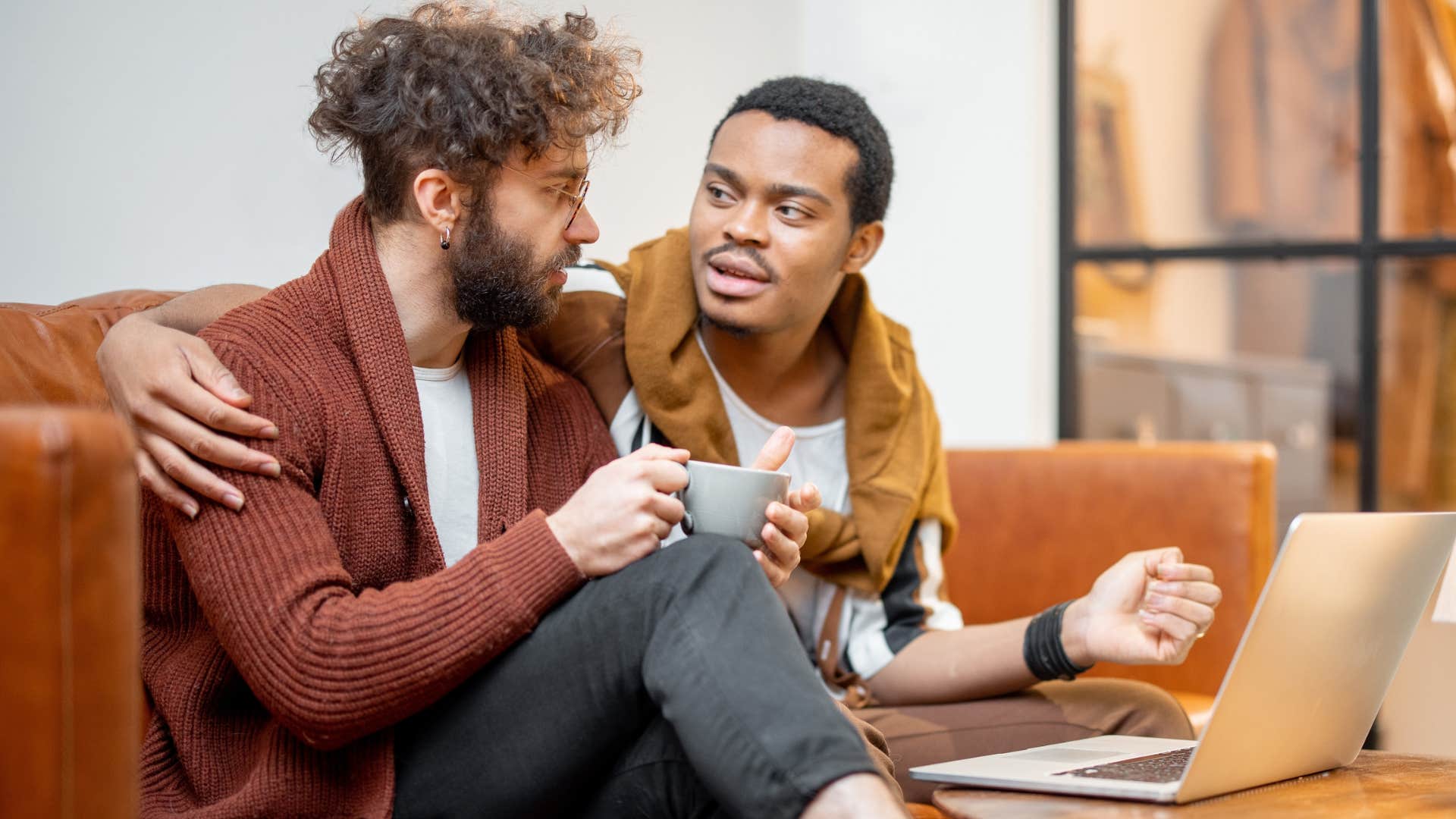 Couple making eye contact and having a serious conversation.