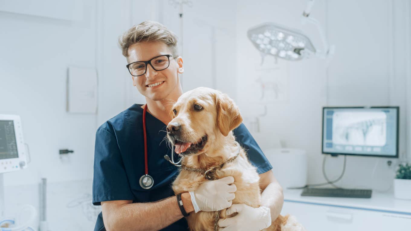 Vet smiling with dog