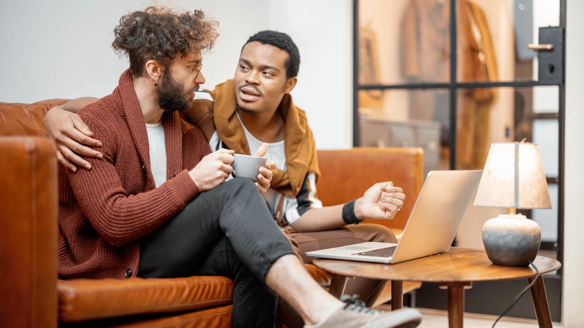 Man comforts another vulnerable man they talk about weakness