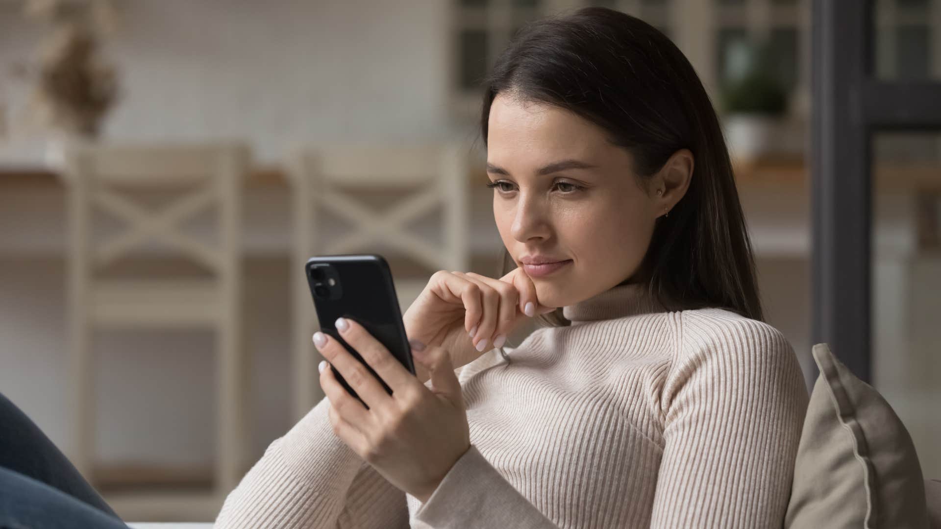 young woman looking at her phone