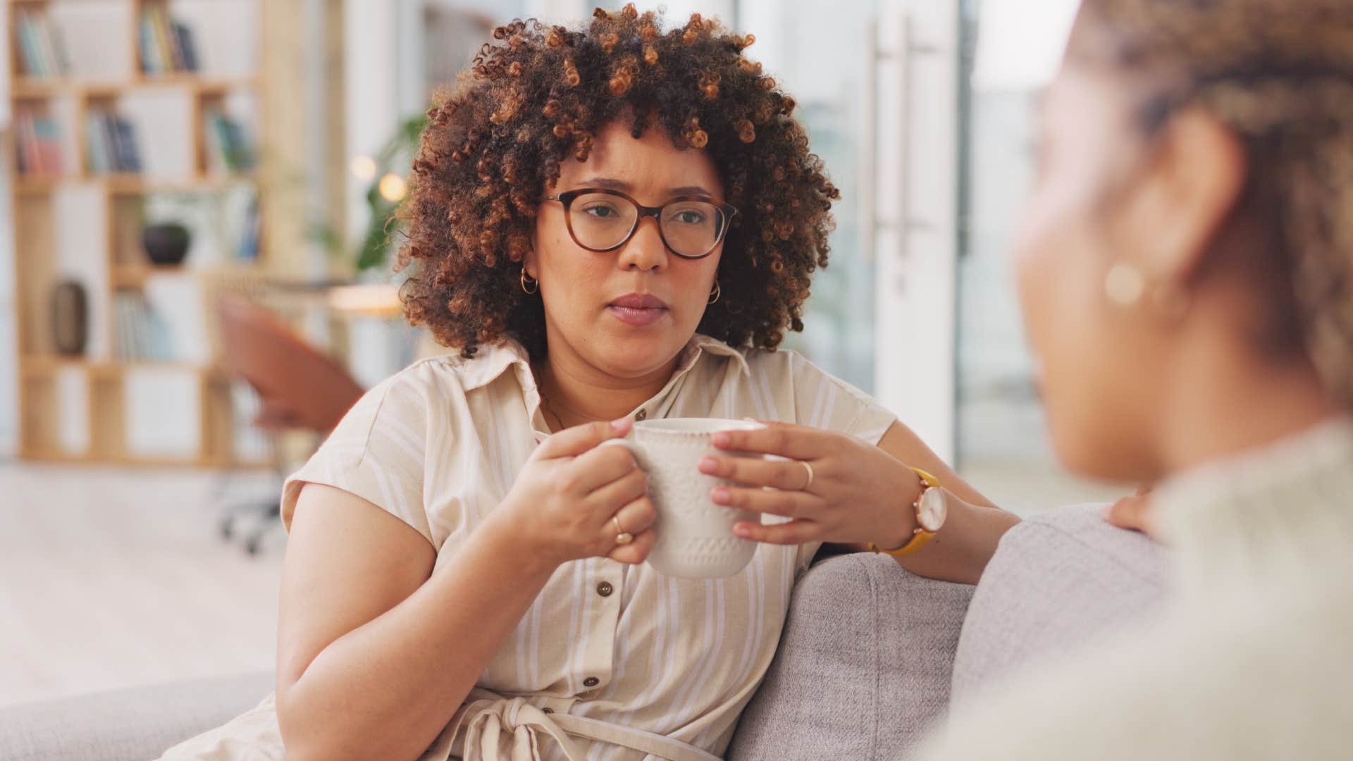 annoyed woman talking to friend