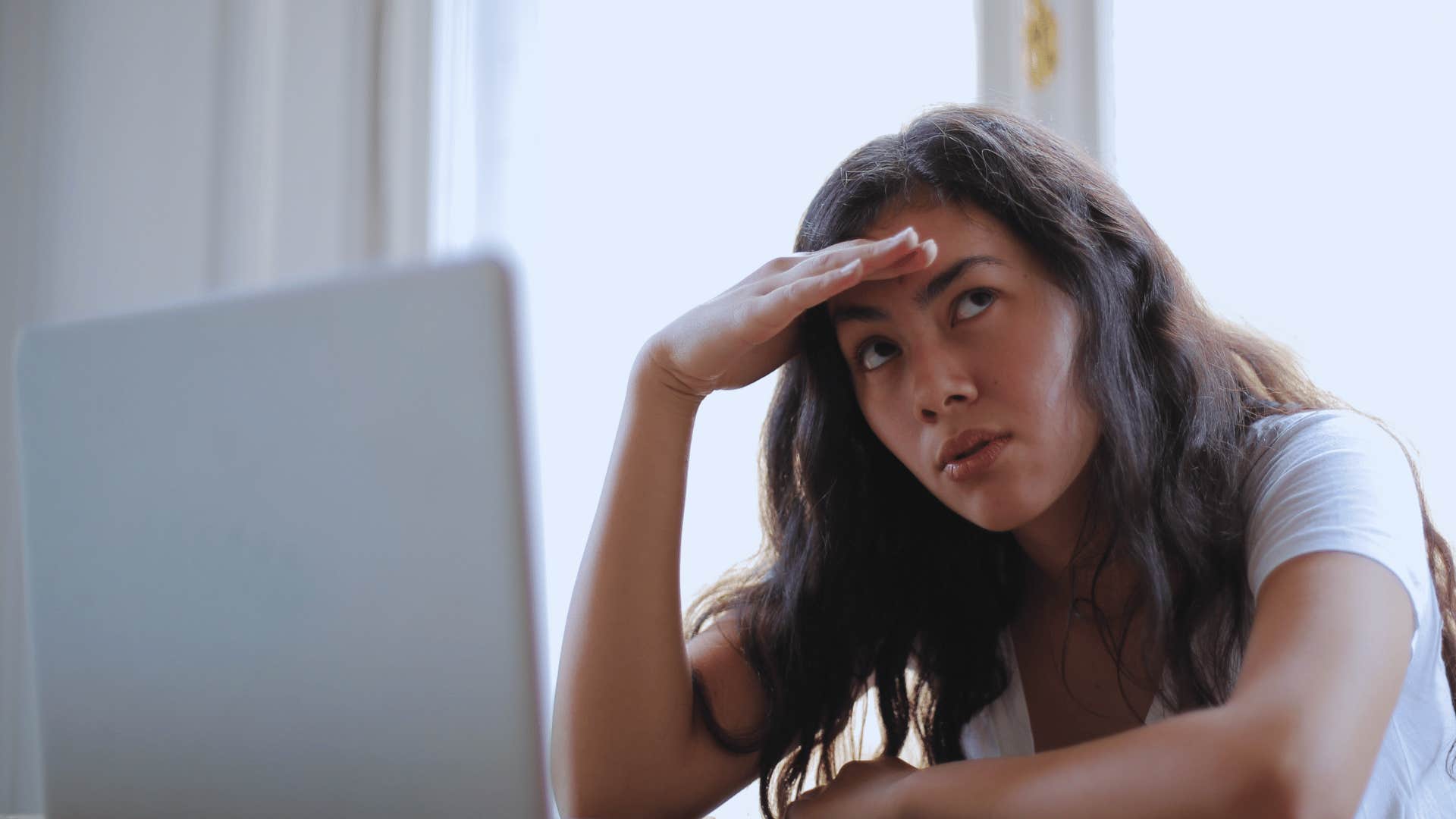 woman thinking about something she learned that was wrong