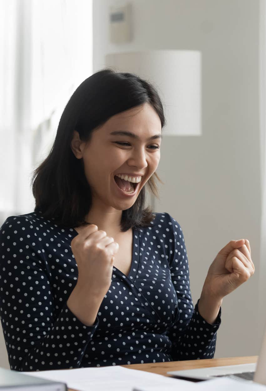 woman celebrating a promotion