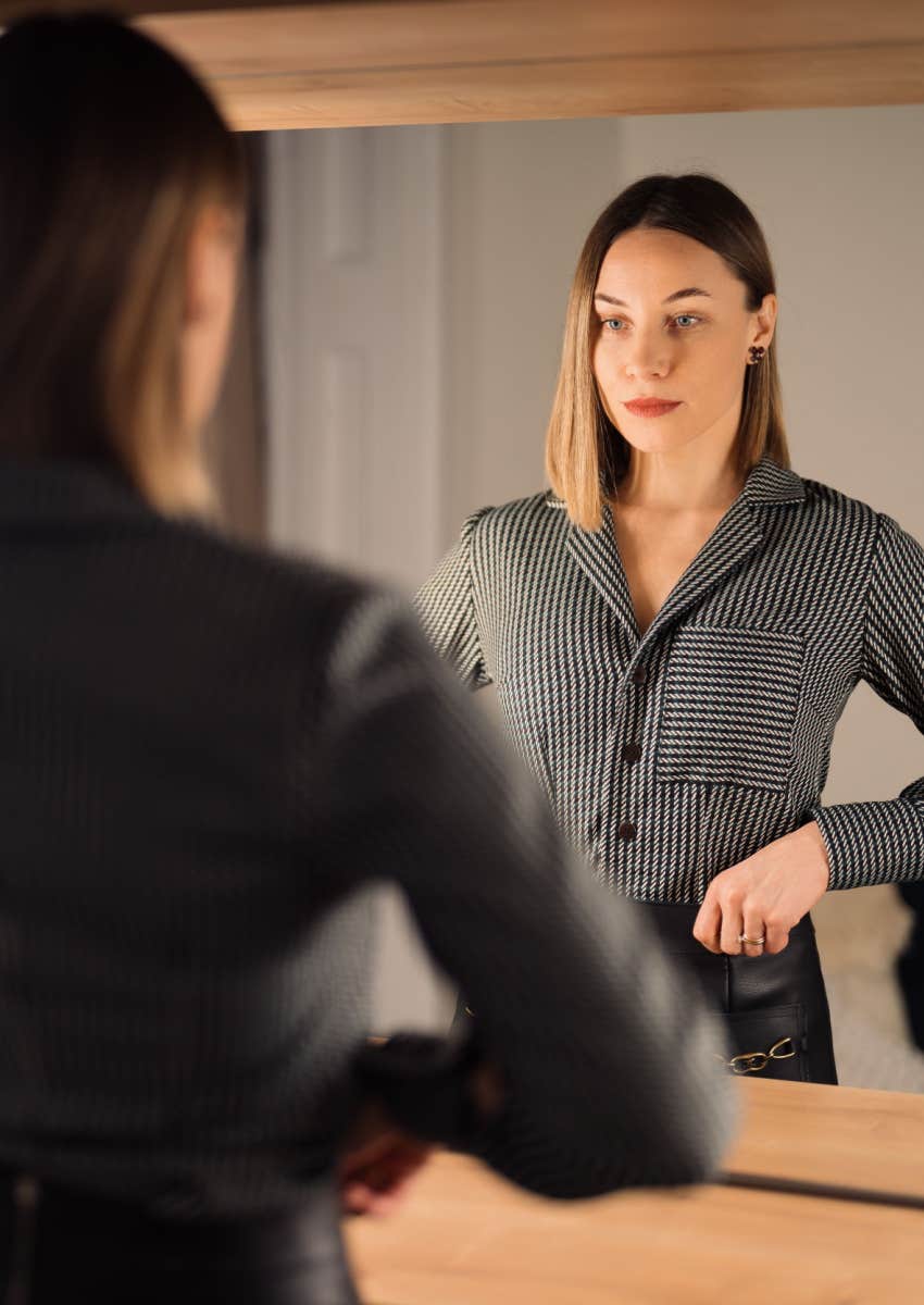 Woman looking at mirror