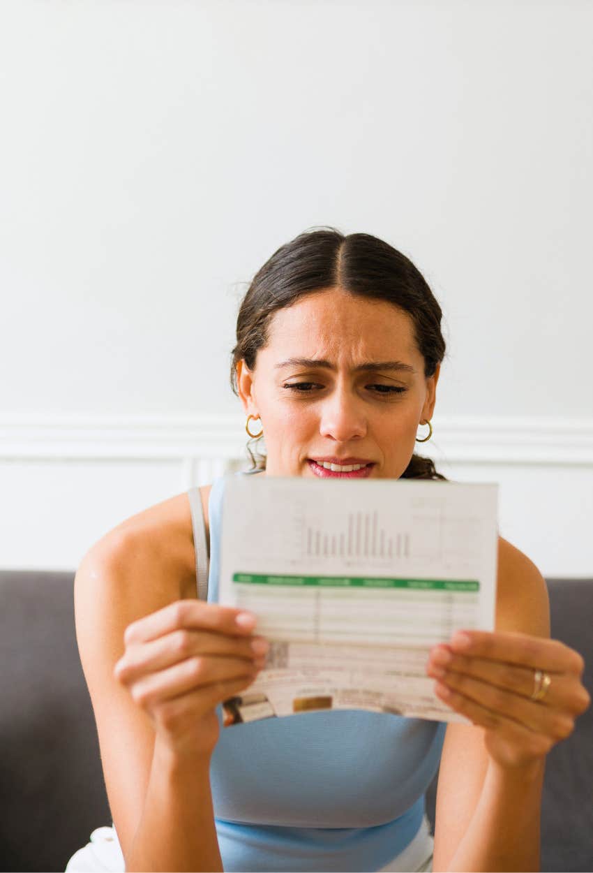 woman looking at her health insurance bill