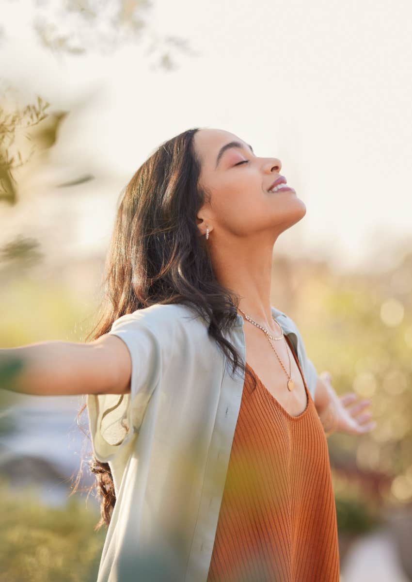 woman with arms outstretched