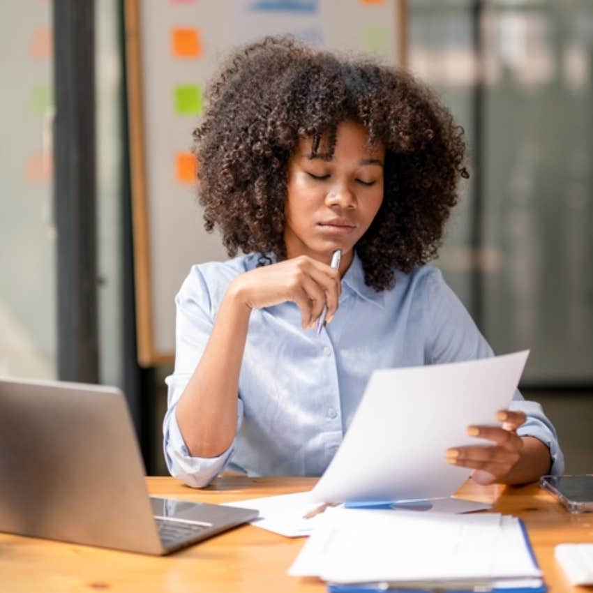 woman working hard at desk