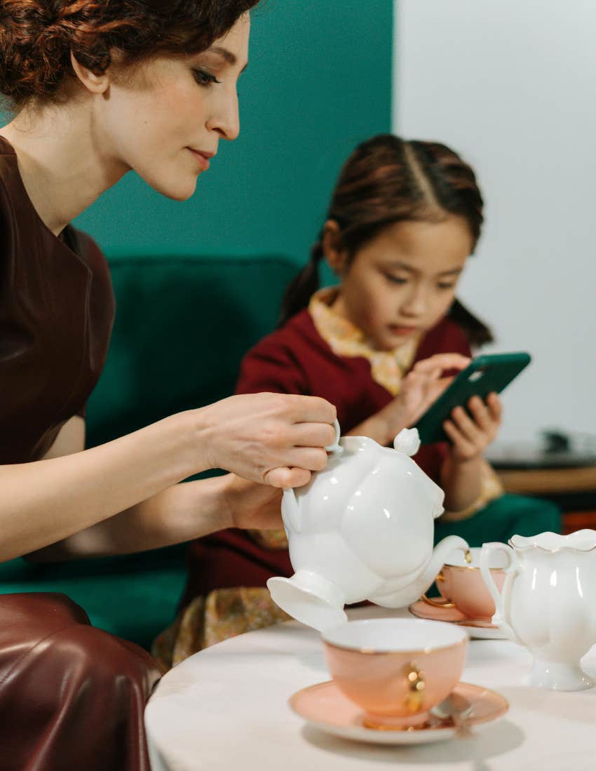 Woman, child, nanny, tea party