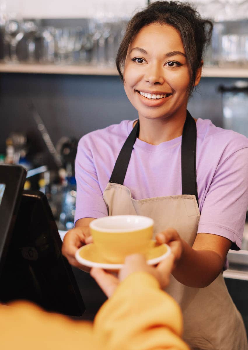 Worker handing drink