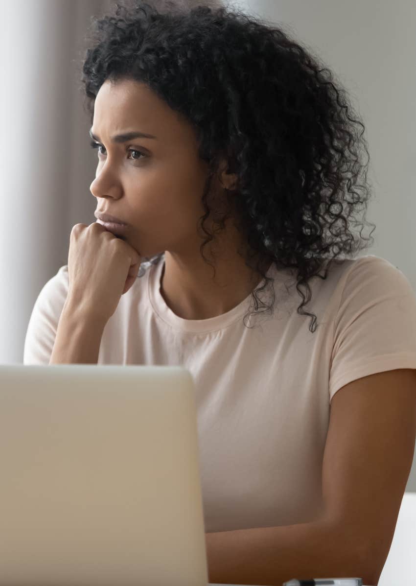 Woman thinking about how to get ahead in her career