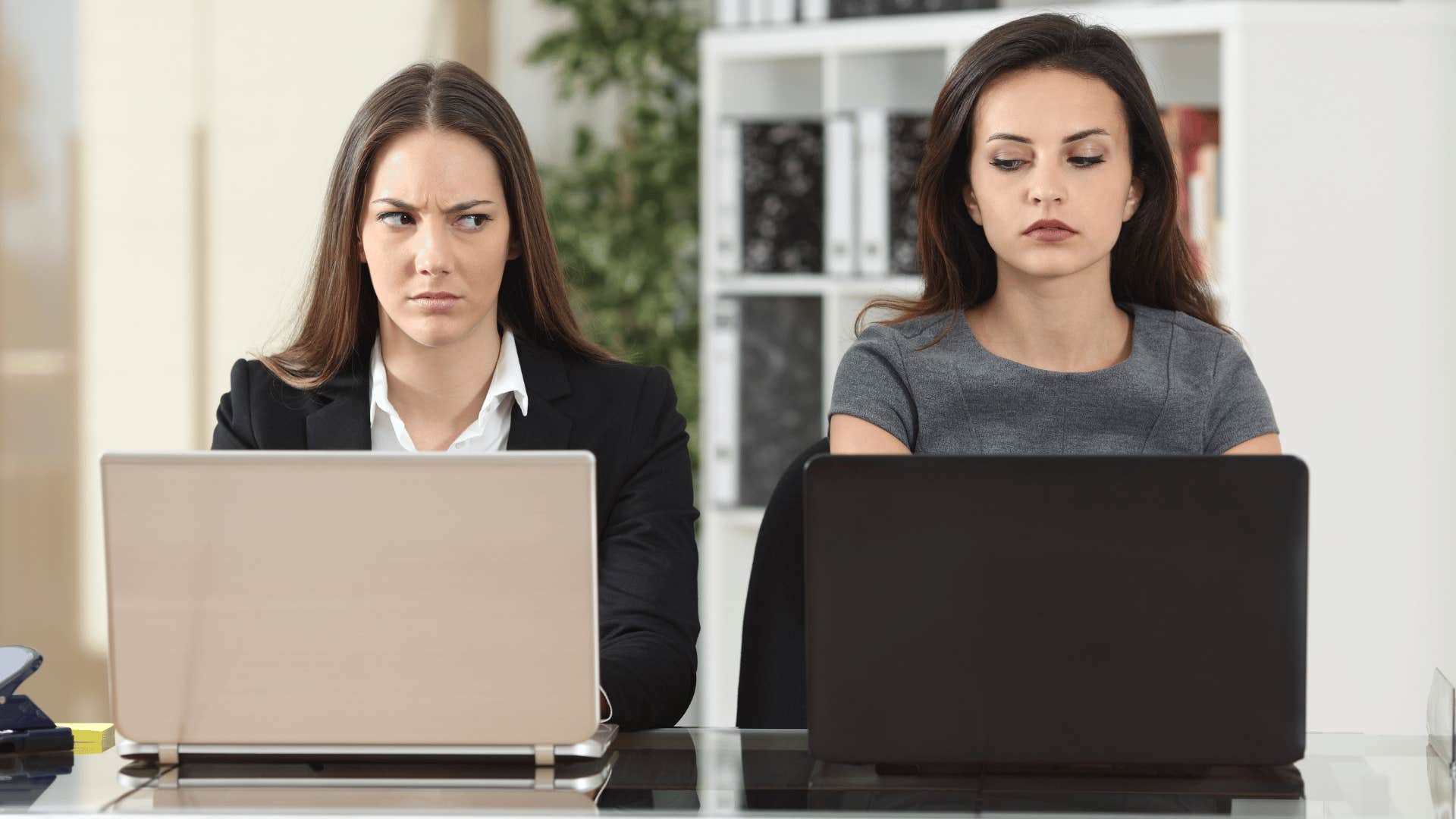 woman looking at each other with disdain