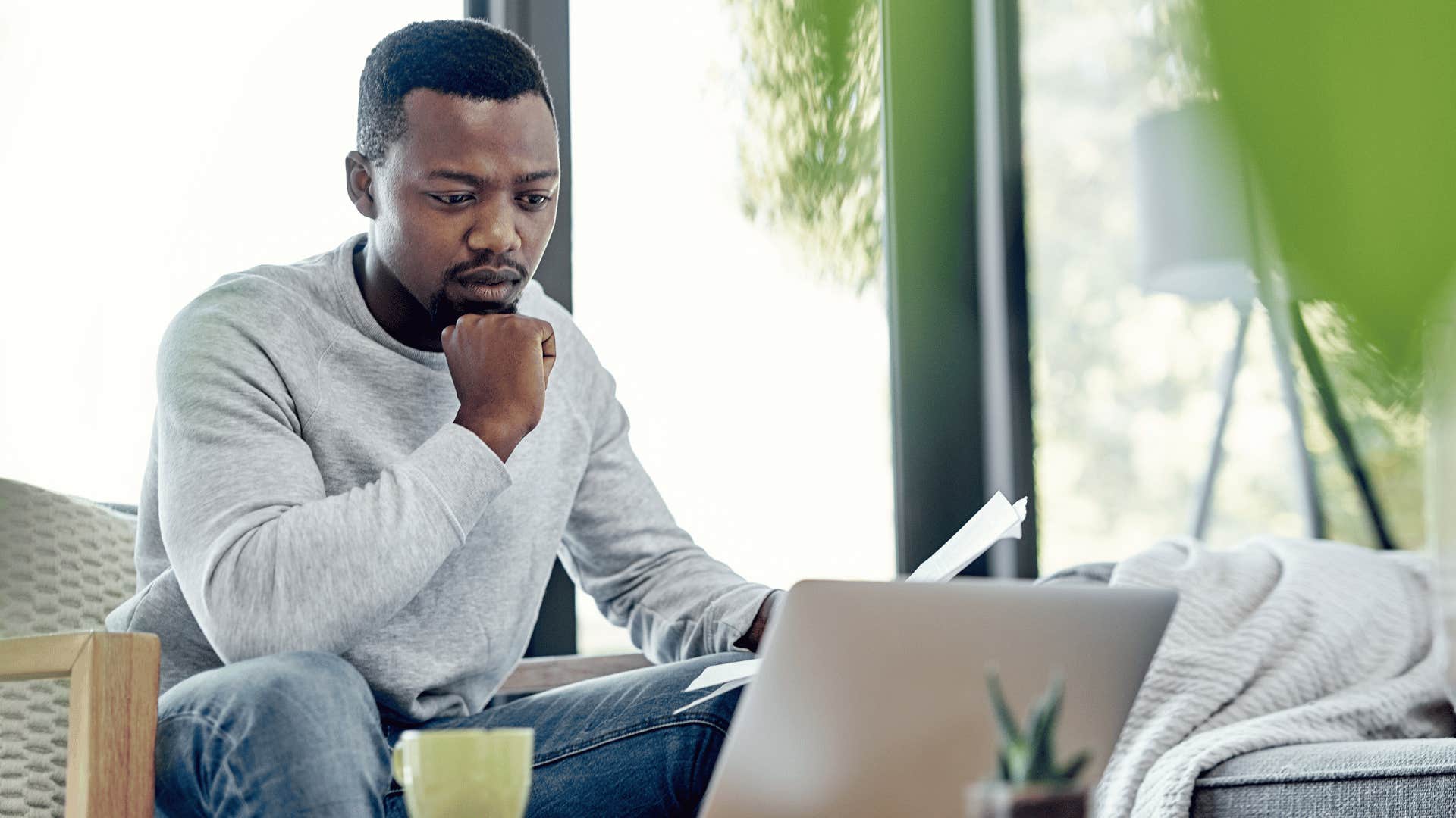 man studying something on laptop