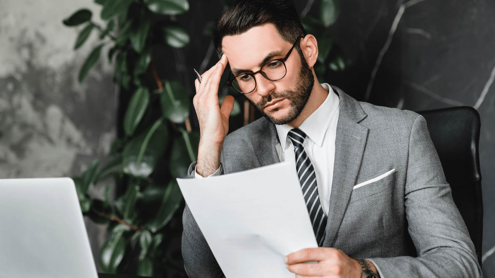 man looking at papers