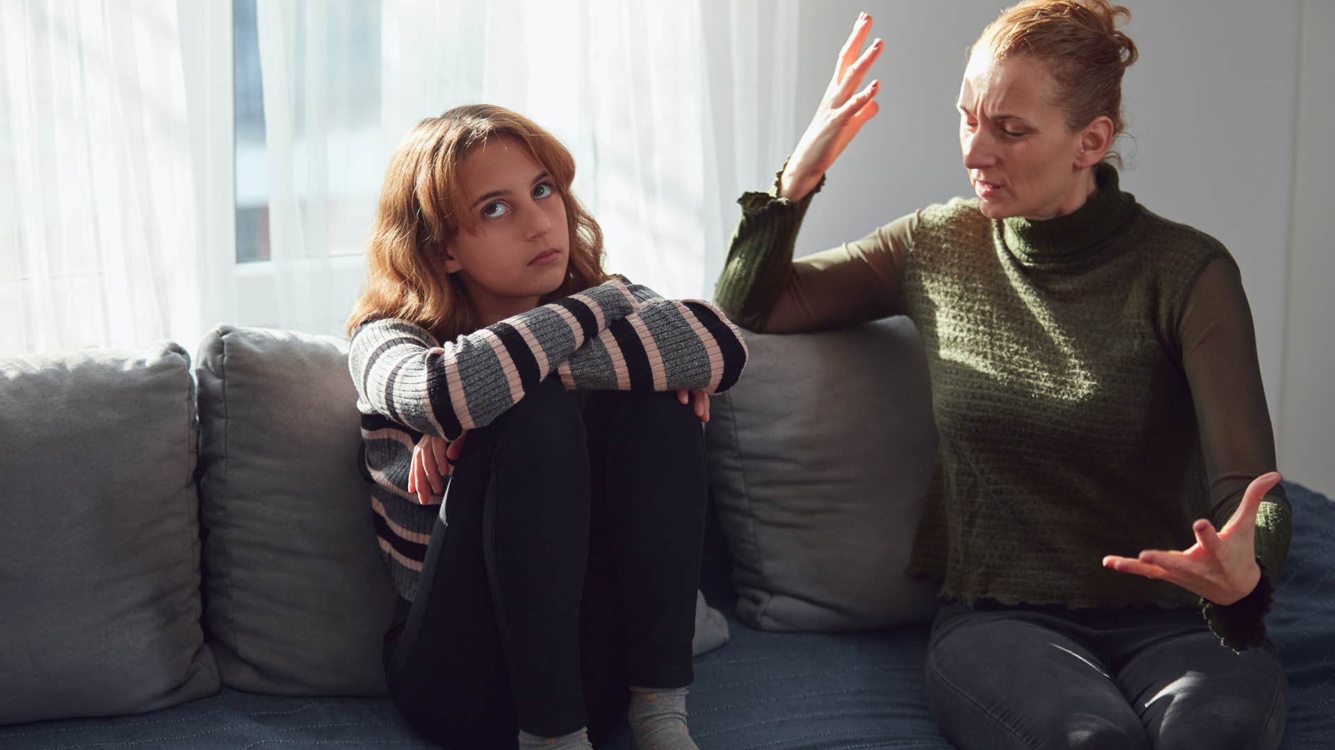 Woman arguing with her upset teenage daughter.