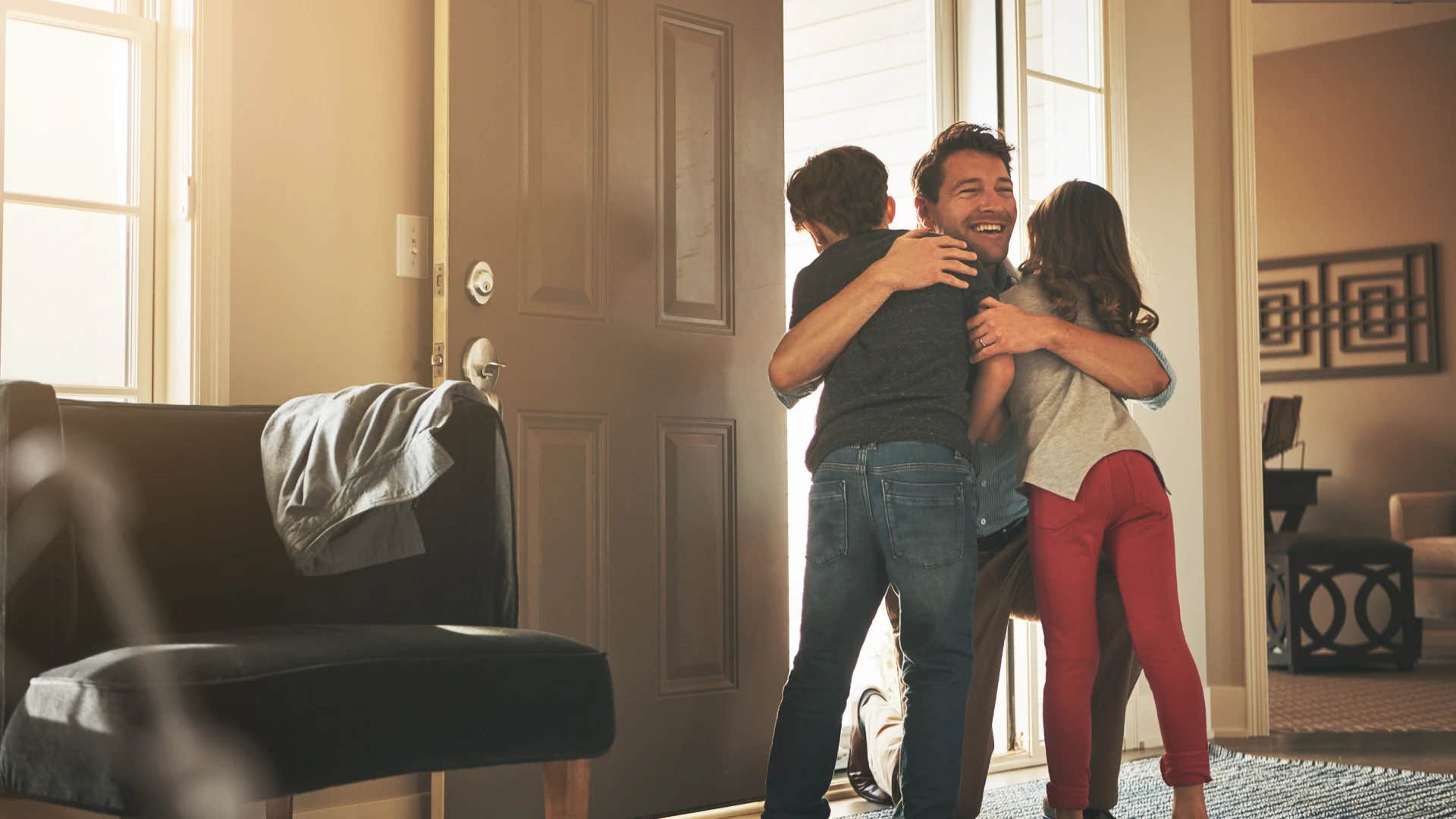 kids greeting their father as he comes home