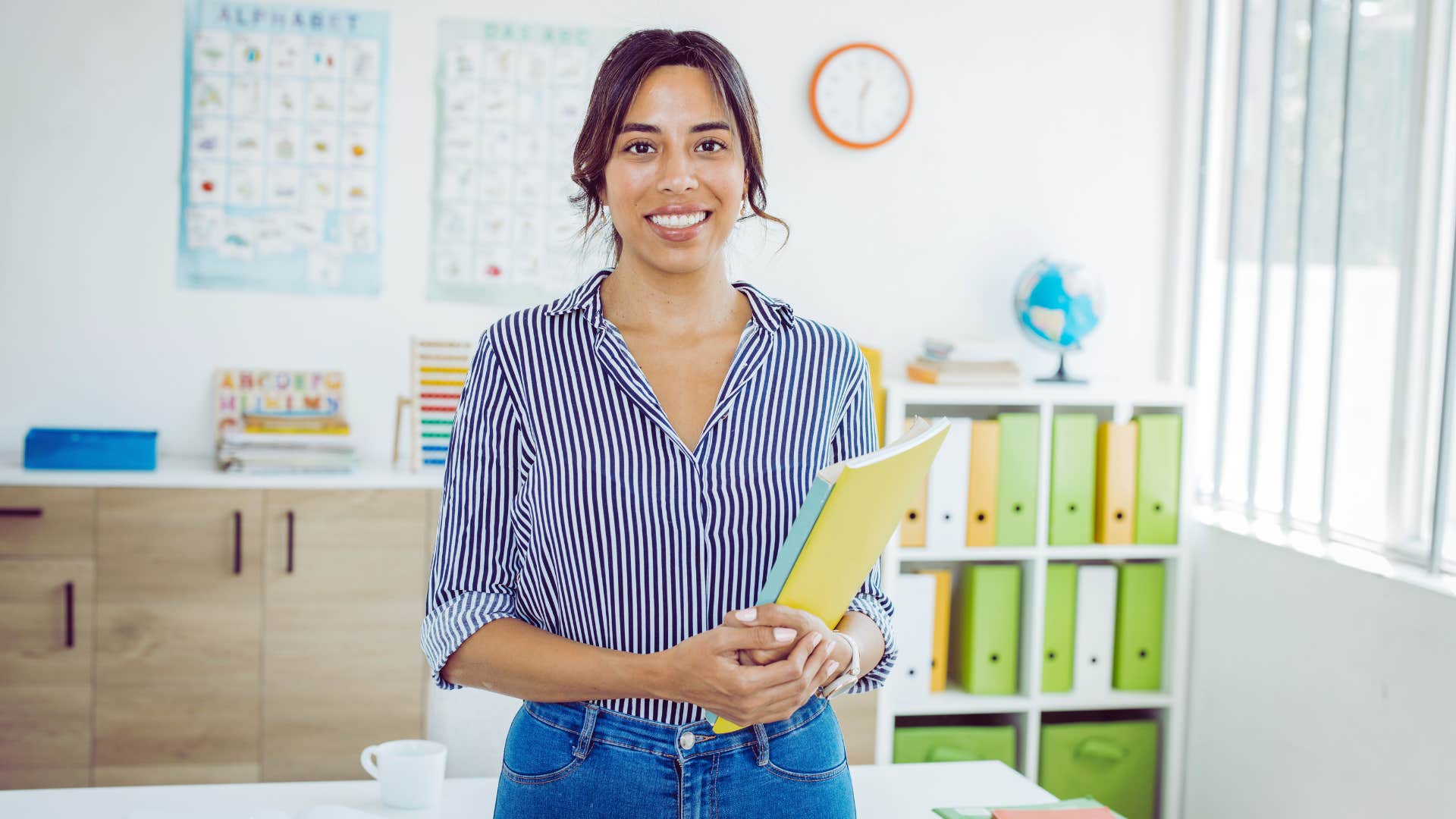 inspiring teacher standing in a classroom