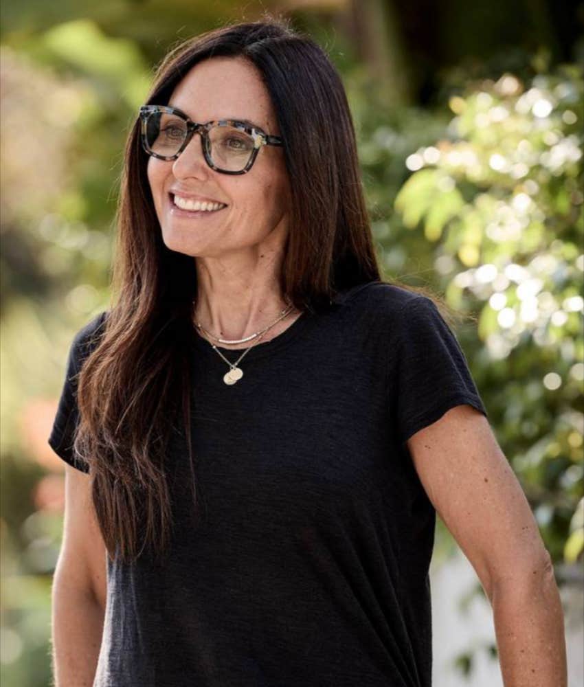 Nicole Sachs in glasses and black tee, grateful for her life and motherhood