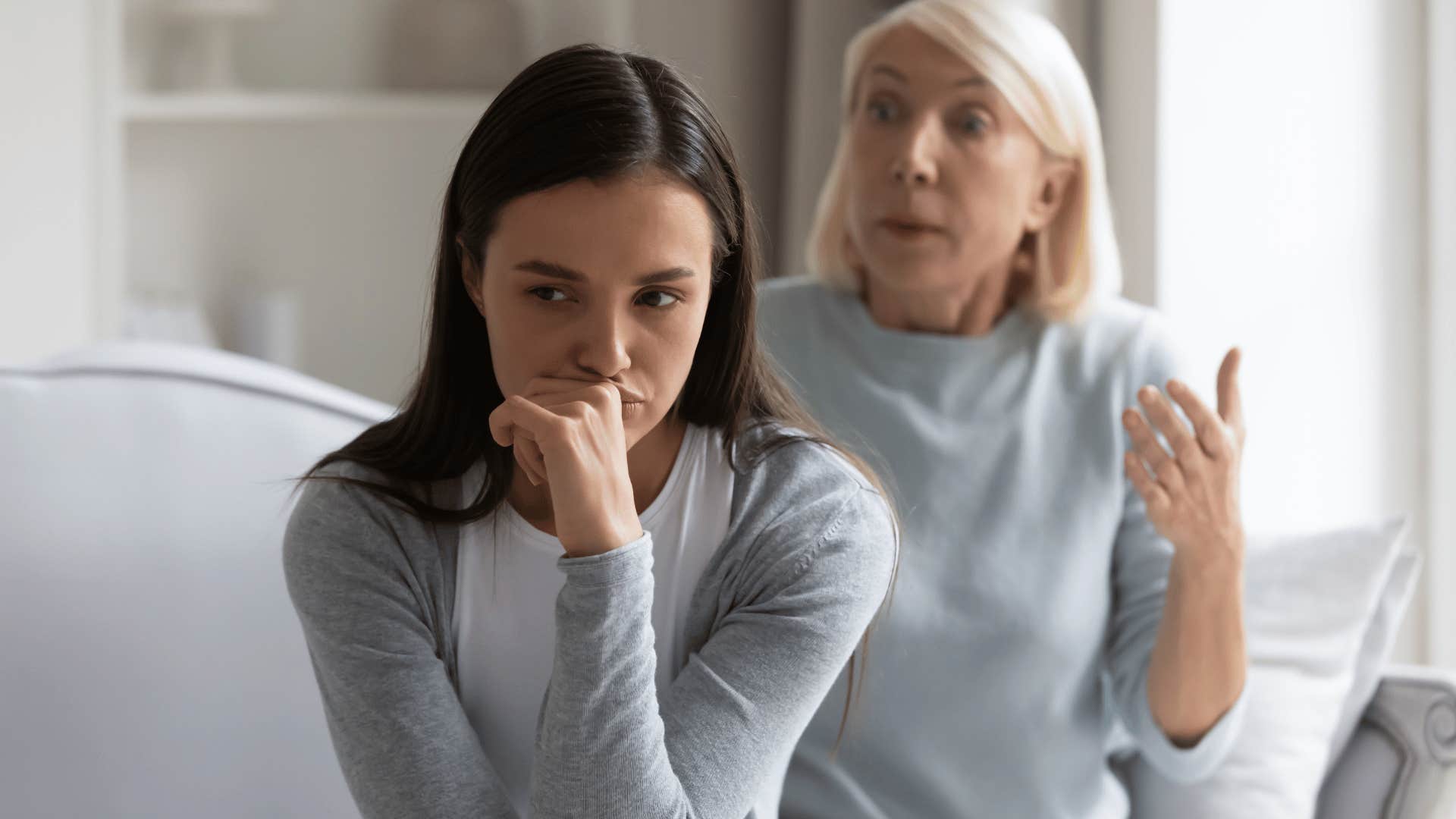 young woman ignoring her mother's advice