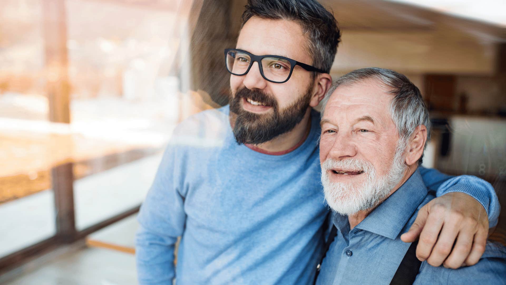 happy adult son and his father